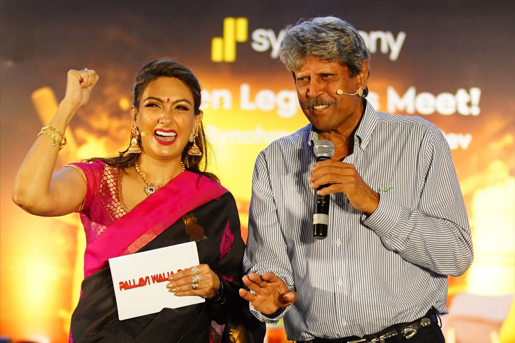 Pallavii Waalia Raaj on stage with Kapil Dev
