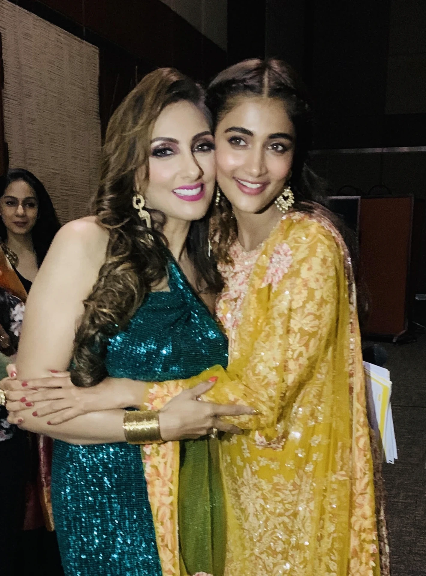 Pallavii Waalia Raaj on stage with Pooja Hegde